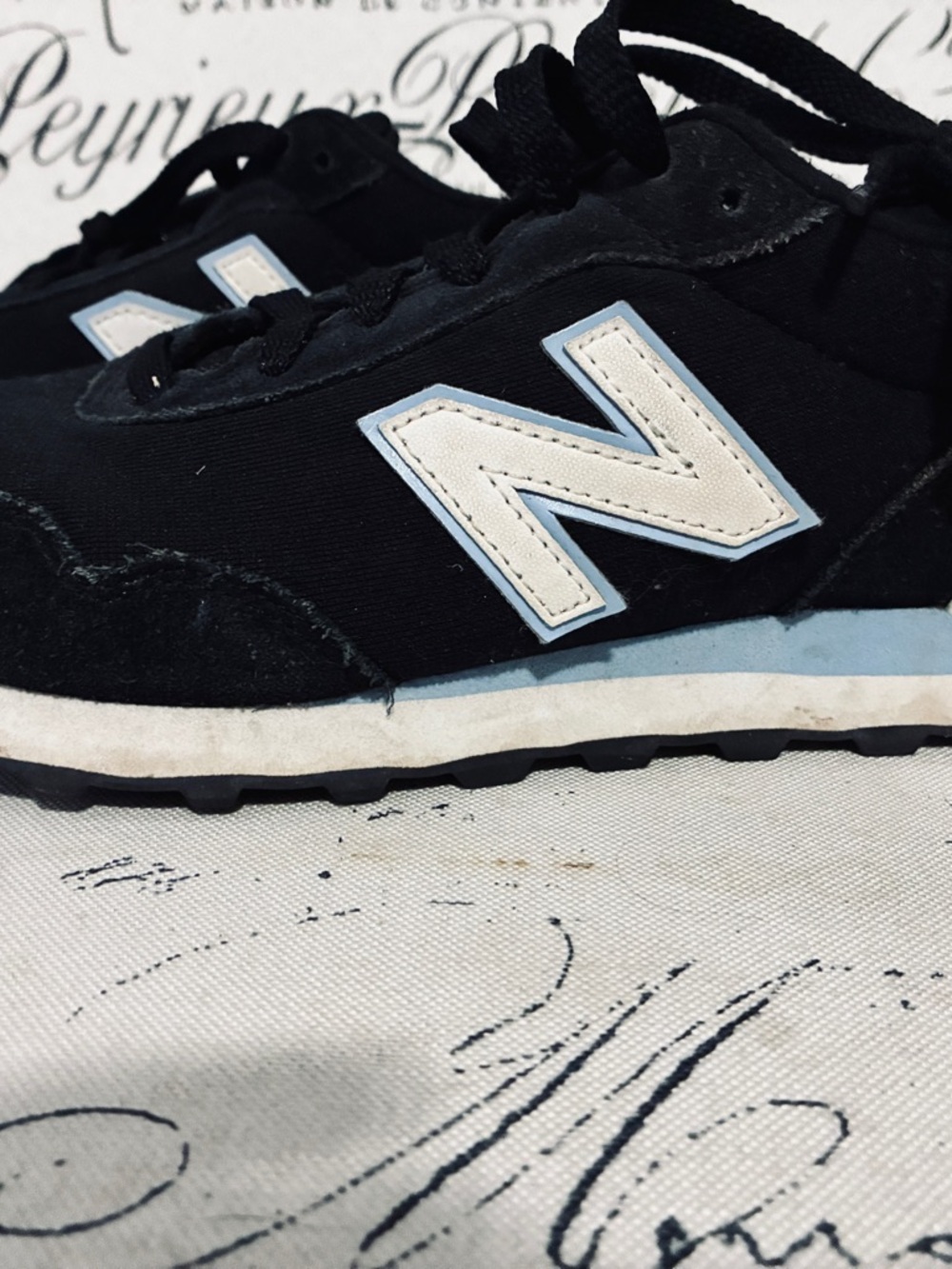 New Balance Black Sneakers with Light Blue Trim and White 'N'